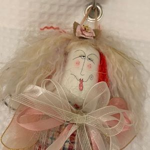 Charming hanging doll